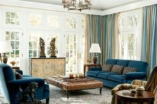 16 navy blue upholstery, blue and beige draperies, beige room decor and a rich brown leather ottoman