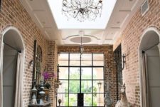 17 raised roof with the large skylight, arched brick doorways for a refined entryway