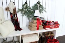 17 red rainboots and gift boxes for a winter hallway