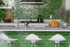 grass green subway tiles as a backsplash and on the kitchen island infuse this kitchen with color still keeping it quite traditional thanks to the type of the tile