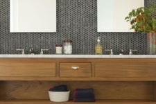 21 natural bathroom with black and grey penny tiles in the sink area