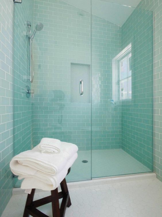mint-colored subway wall tiles create a serene setting in this cozy bathroom