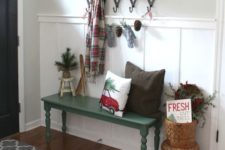 22 place a couple of baskets and a pinecone garland to make the entryway winter-like