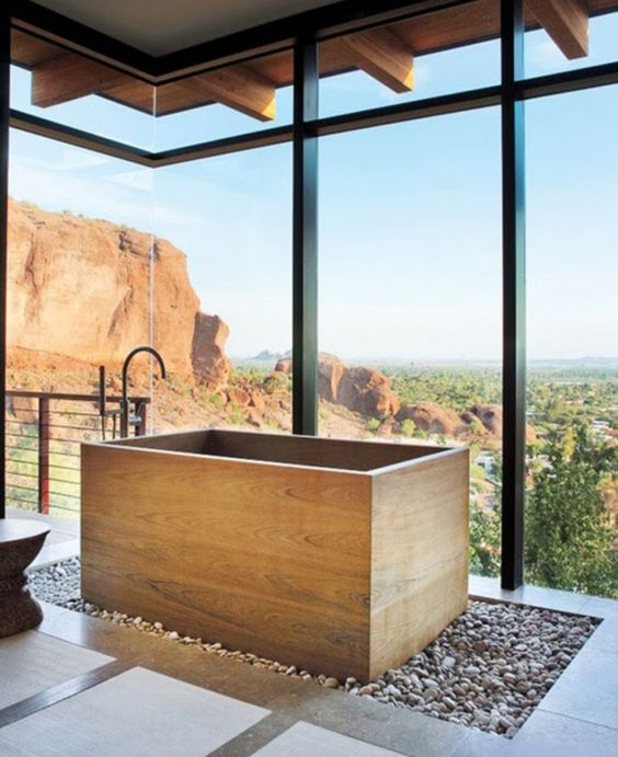 wooden soaking bathtub with a view