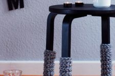 24 Frosta stool painted black and with crochet leg covers to embrace the winter