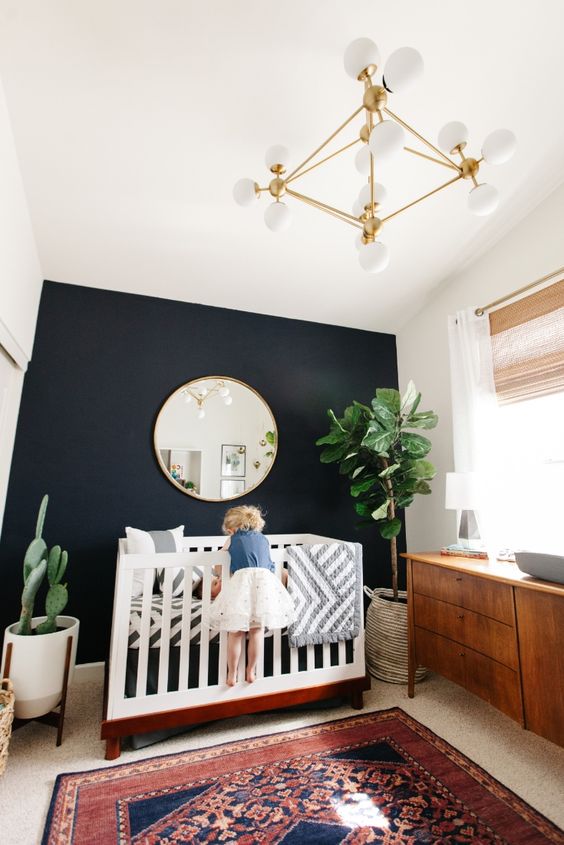 black accent wall in a kid's room for a mid-century modern interior