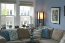 27 light blue walls and textiles and a tan couch look refined