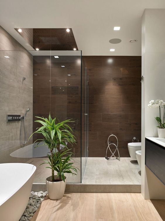 potted greenery and orchids add a chic Japanese feel to this modern bathroom