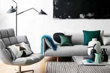 31 modern living room with light grey upholstery and a couple of green accents