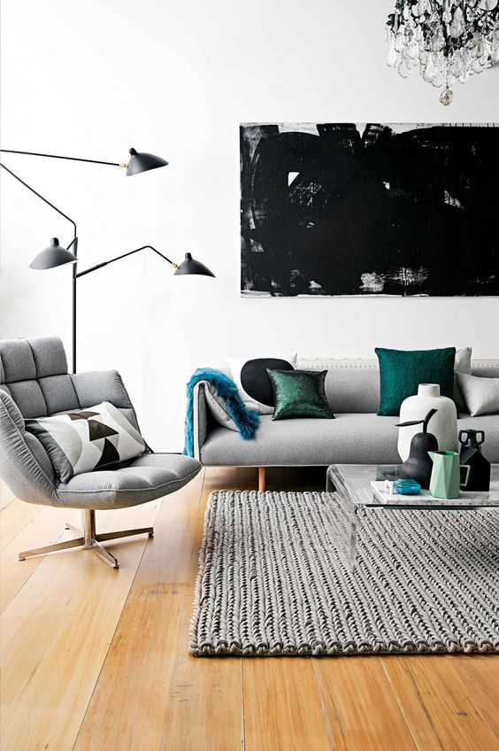 modern living room with light grey upholstery and a couple of green accents