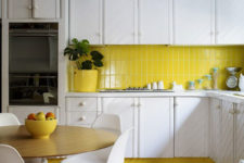31 vertical stack bond clad subway tiles in this kitchen add a pop of color