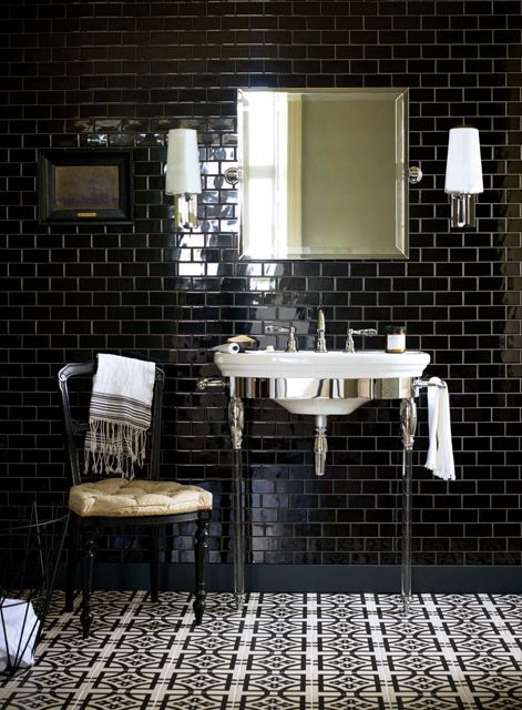 Atlantic basin and washstand with glass legs, black subway tiles in offset pattern