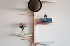41 wall-mounted shelf made of several stools and painted in pastel colors