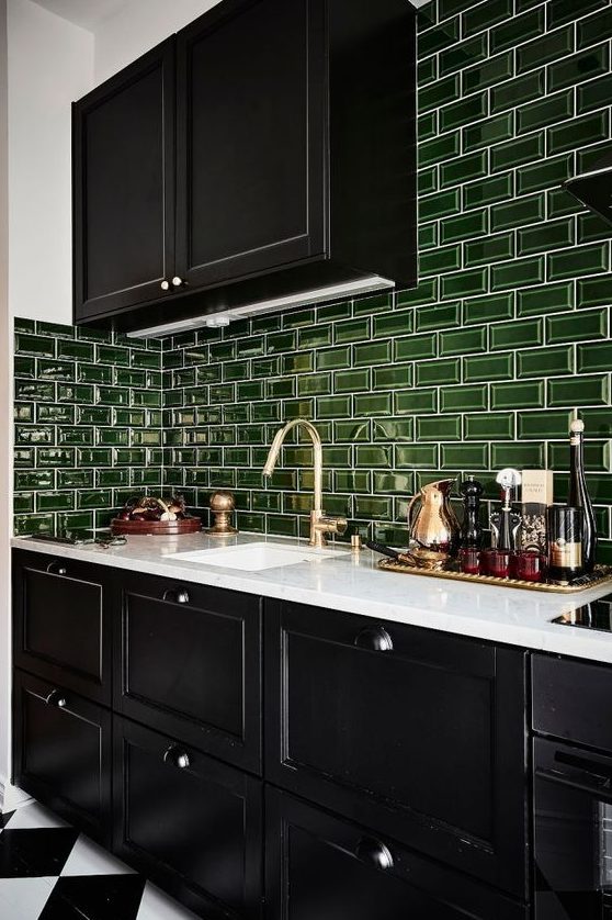 a bold black and white kitchen with glossy green subway tiles for a touch of color is very cool