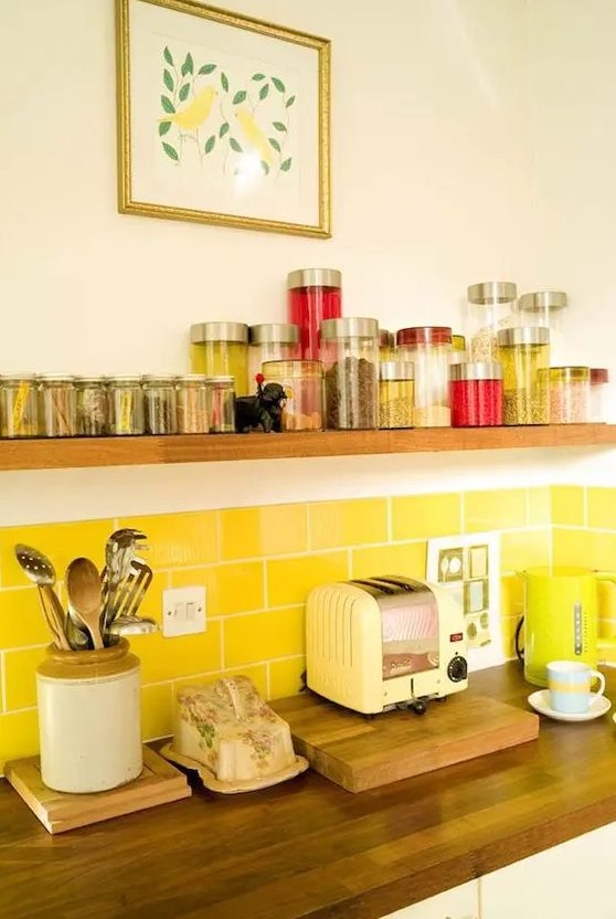 a bright yellow subway tile backsplash is a cool and sunny touch to your neutral kitchen is a very lovely idea