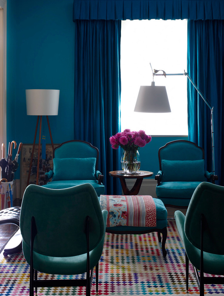 A mix of blue shades of walls, curtains and furniture in this room looks great with little wooden accents.  (Scott Weston Architecture Design PL)