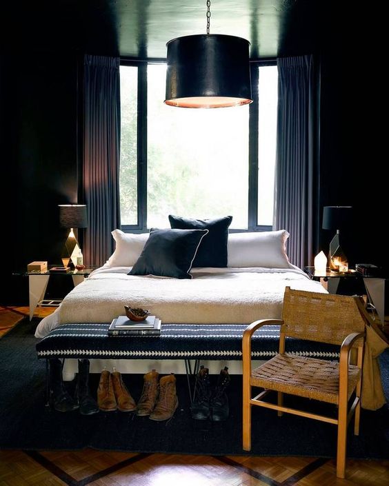 a chic moody bedroom with an art deco twist and geometric and gold details, a black pendant lamp and a black hairpin bench 25+ Romantic Dark & Cozy Bedroom Ideas