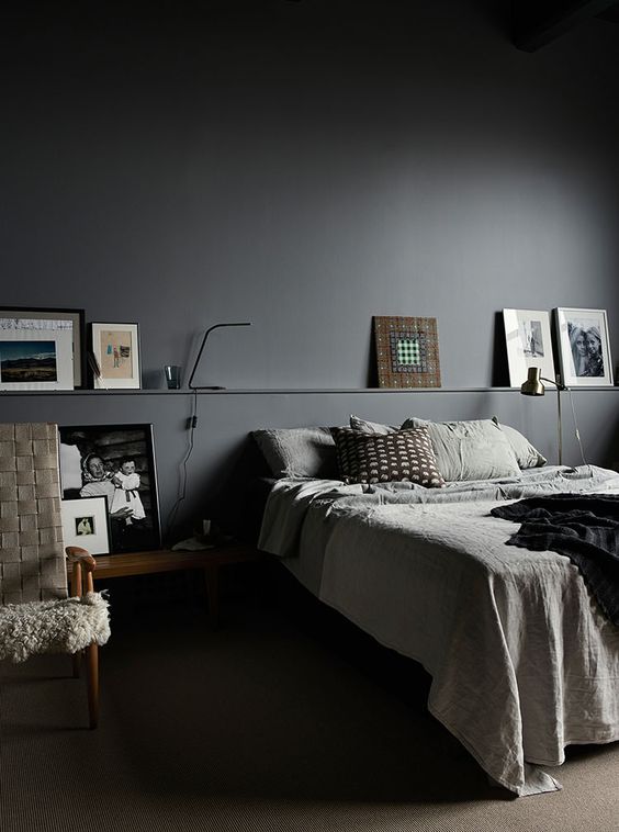 graphite grey walls, functional design and warm woods to soften the look