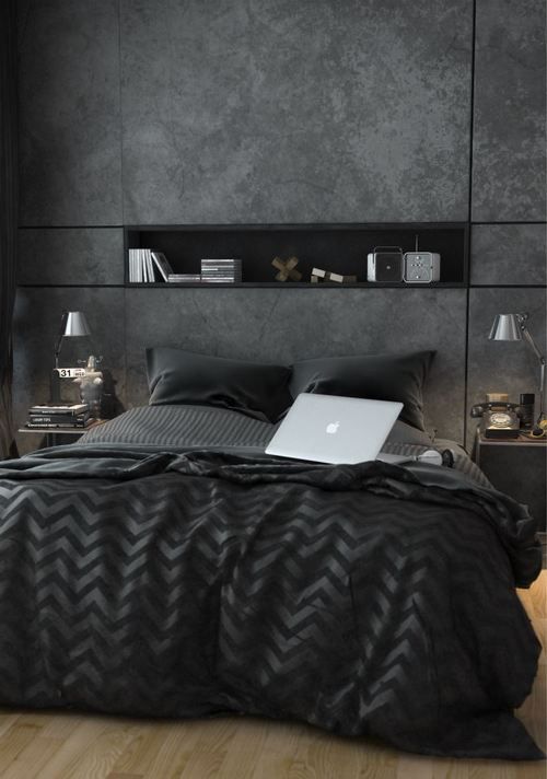 a cool modern black bedroom with a wall niche for storage, a couple of nighstands and cool black bedding