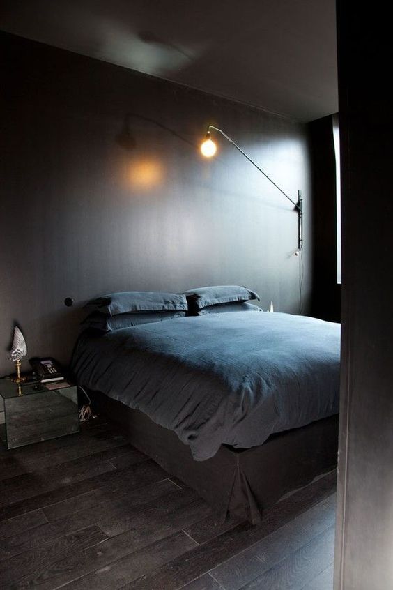 ultra-minimalist bedroom in the shades of brown with a mirror nightstand