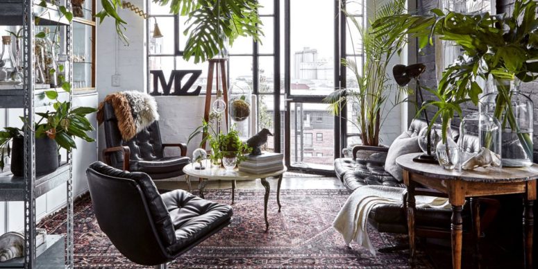 This unique loft seems to be taking us to the Victorian times wwith its antique fruniture, moody colors and faux taxidermy looking like natural