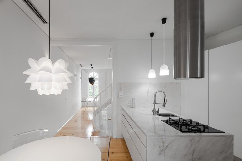 white interior White color is methodically repeated on walls, ceilings, carpentry and marble to make the interiors modern and spacious