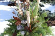 02 a bucket with evergreens, branches, lotus and pinecones