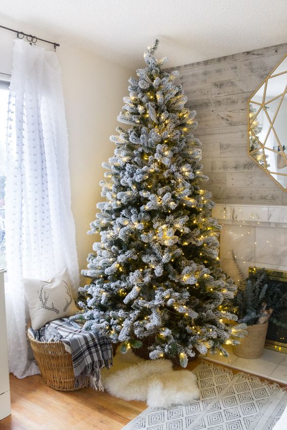 a flocked tree decorated with only lights for those who want maximize natural look