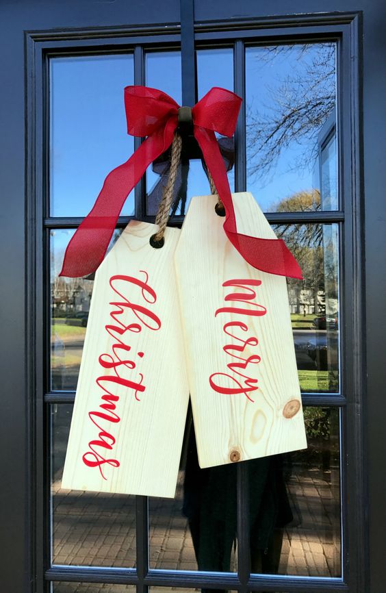 giant tags of wooden boards and a red bow (you can buy it on etsy)