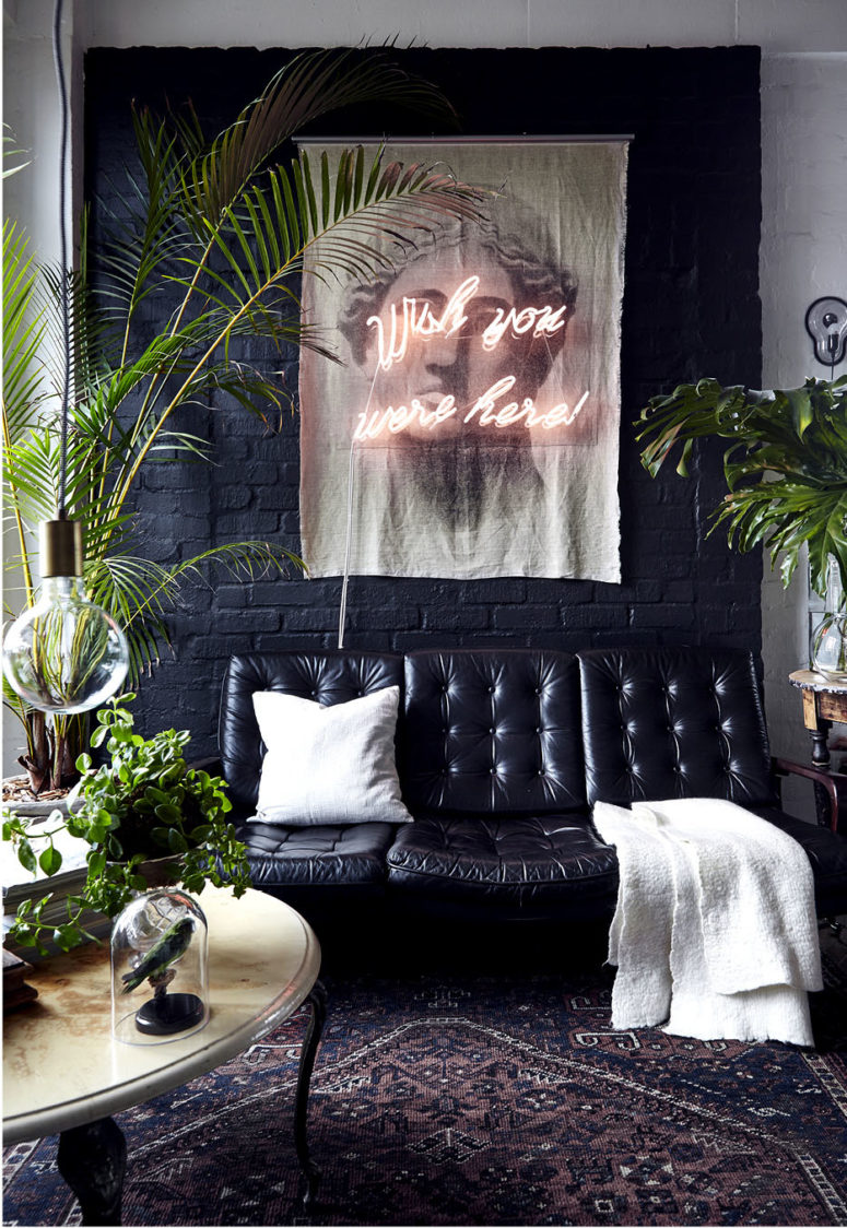 Black and white were softened with lots of potted greenery, and though the owner doesn't have a garden, he doesn't miss it Black and white were softened with lots of potted greenery, and though the owner doesn't have a garden, he doesn't miss it