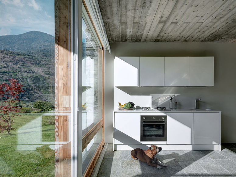 kitchen with a view The interiors are modern, almost minimalist with rustic touches and they center around the views like this kitchen