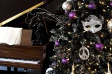 03 a black tree with whimsy decor and silver and purple ornaments