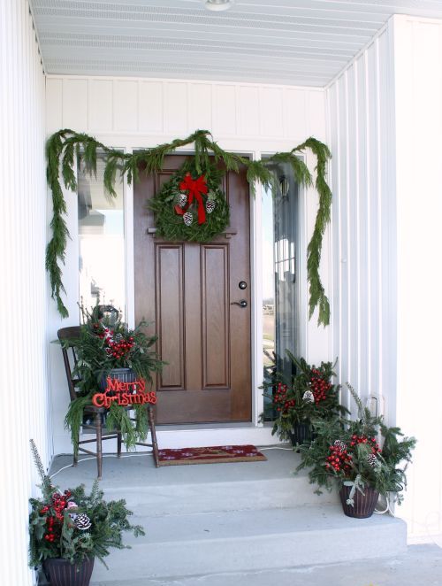 evergreen garland, wreaths and arrangements in baskets for simple decor