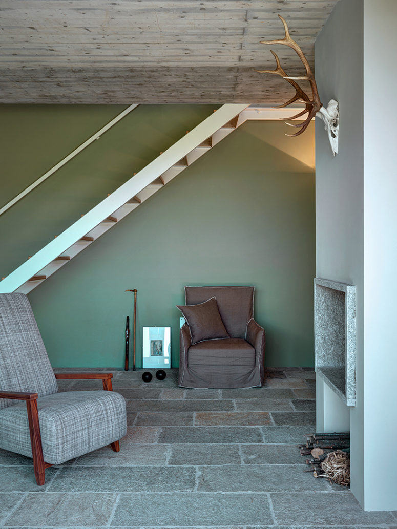 The ground level features luserna stone, emphasizing a continuity between internal and external space The ground level features luserna stone, emphasizing a continuity between internal and external space