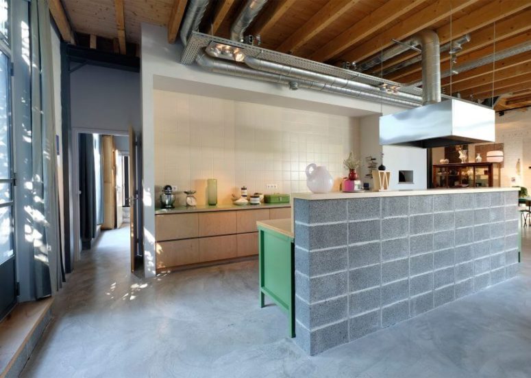 minimalsit ktichen The kitchen has pure white tiles, exposed pipes and a unique concrete countertop imitating brick clad