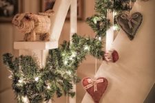05 cute fir garland with lights and sewn hearts hanging