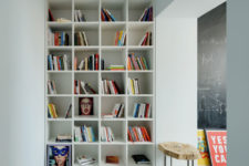 06 A large floor to ceiling bookshelf is placed between two areas, so it doesn’t take necessary floor space in the two main zones