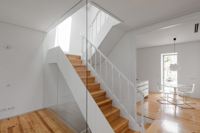 wooden flooring The interior went back to its spacial and functional layout, wooden floors and ceiling structures and the staircase