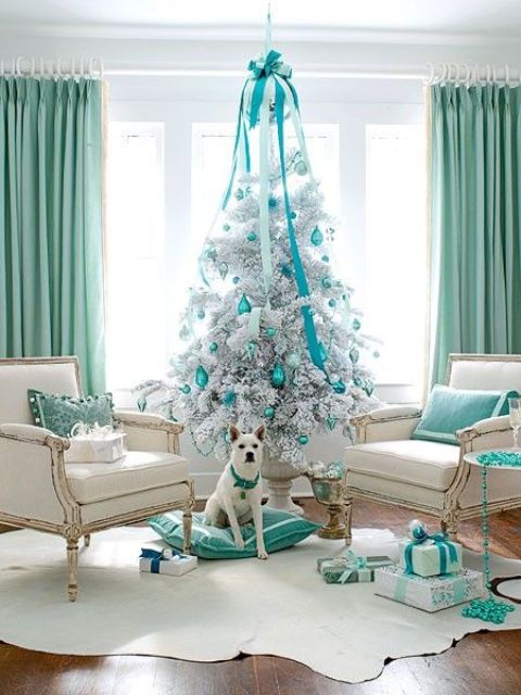 https://www.digsdigs.com/photos/2016/11/06-a-white-Christmas-tree-with-tiffany-blue-ornaments-and-a-large-bow.jpg