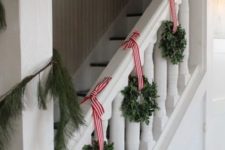 06 eucalyptus wreaths with striped ribbon and a fir garland