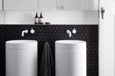 07 The white free-standing sinks look outstanding in front of charcoal geometric tiles
