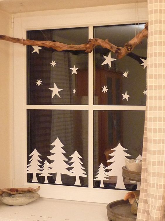 fir trees and stars from paper attached to the window