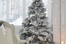 07 flocked tree with no decor is ideal for a white or neutral interior