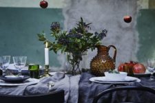 07 rustic table setting with dark textiles and hanging apples