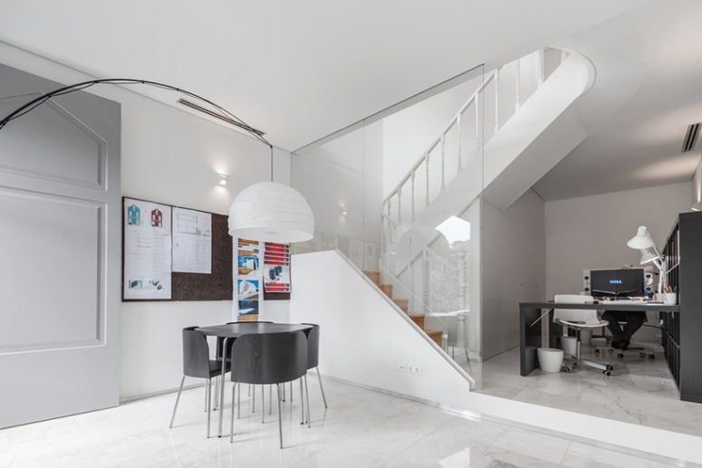 the ground floor is designed as an office space for working, and here you can also see lots of white the ground floor is designed as an office space for working, and here you can also see lots of white