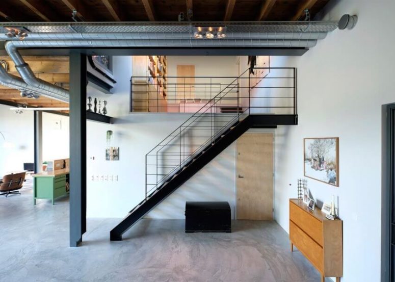 The stairs are industrial, and there are a lot of exposed pipes everywhere that bring that edgy industrial touch The stairs are industrial, and there are a lot of exposed pipes everywhere that bring that edgy industrial touch