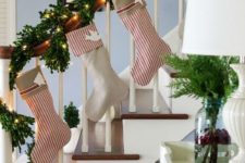 08 evergreen garland that wraps the banister and striped stockings