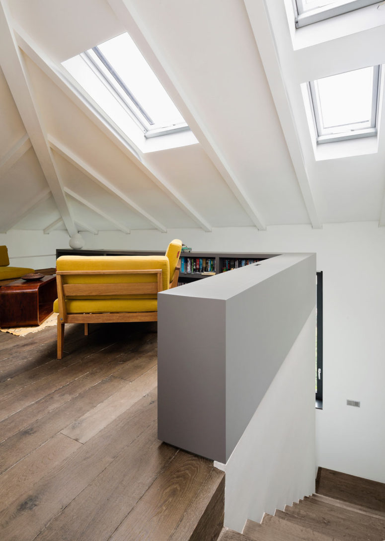 Even the attic space was smartly used and decorated with mid-century modern furniture, attic windows bring much light in