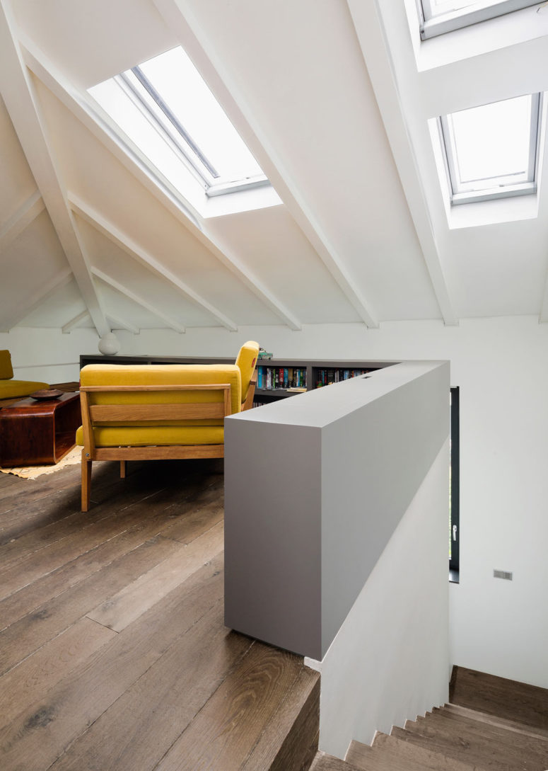 smart attic Even the attic space was smartly used and decorated with mid-century modern furniture, attic windows bring much light in