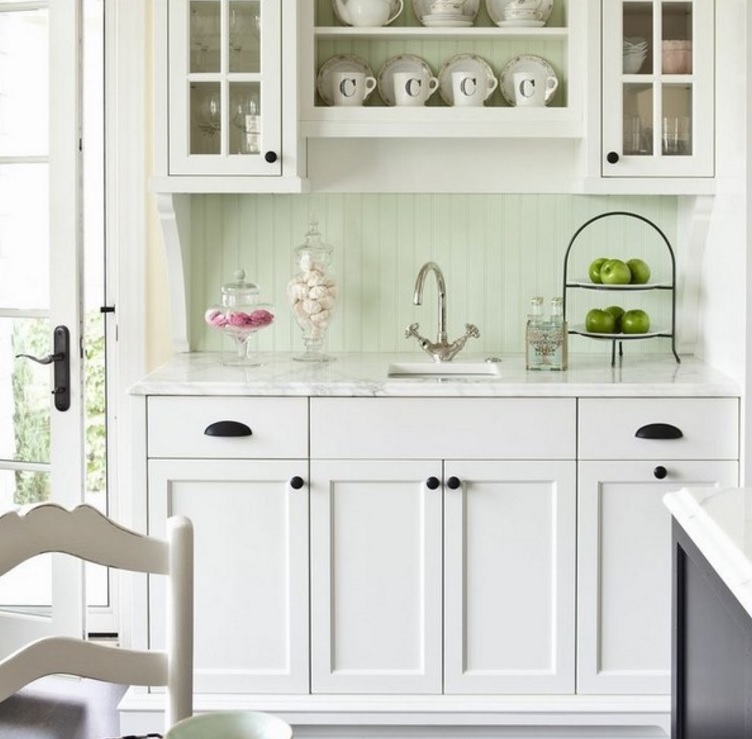 narrow mint-colored beadboard backsplash gives a vintage feel to the kitchen